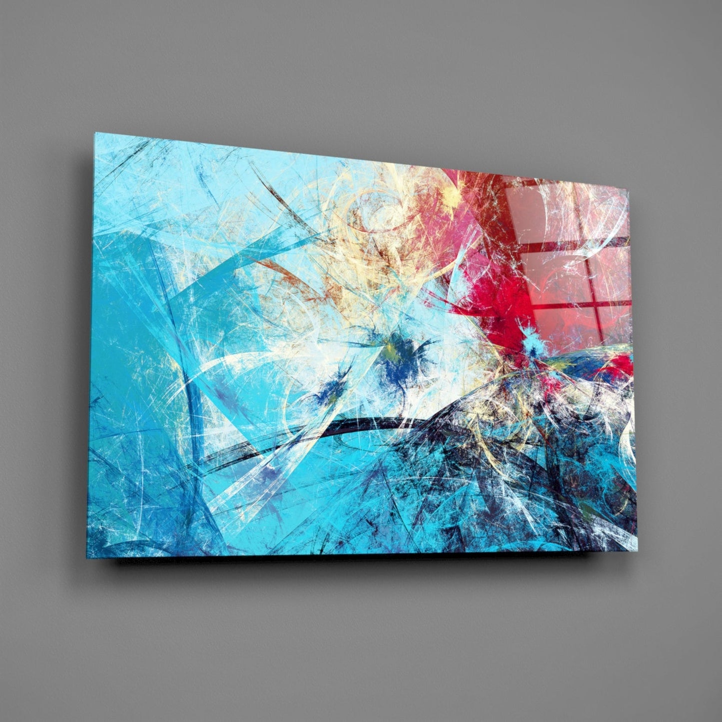 Modern abstract glass wall art featuring layered turquoise, red, and cream brushstrokes with geometric line elements, displayed at an angle against gray background.