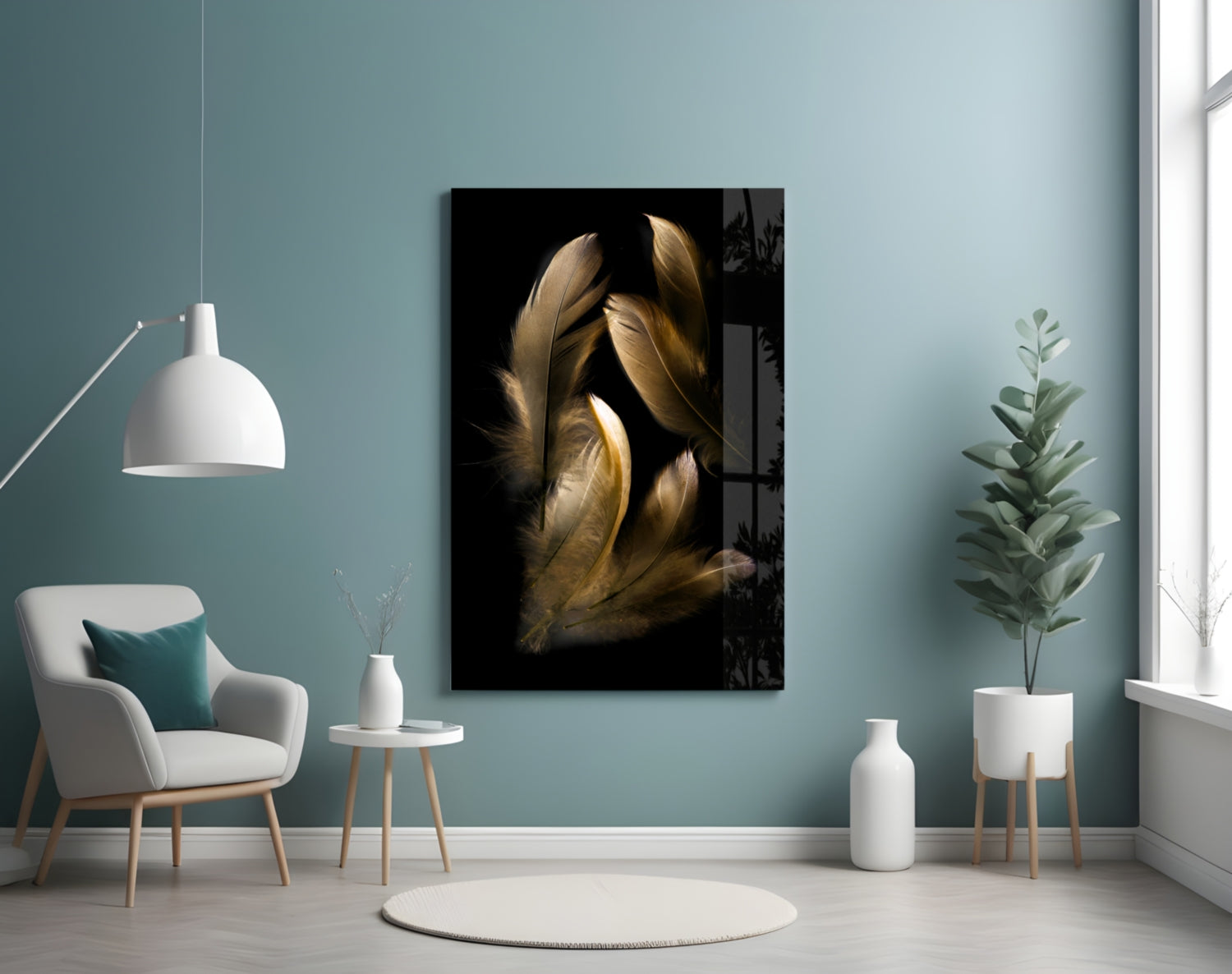 Tan feather glass wall art displayed in a minimalist room setting with pale blue walls, white furniture, and potted plants.