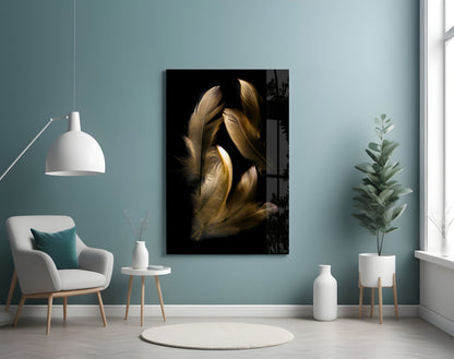 Tan feather glass wall art displayed in a minimalist room setting with pale blue walls, white furniture, and potted plants.