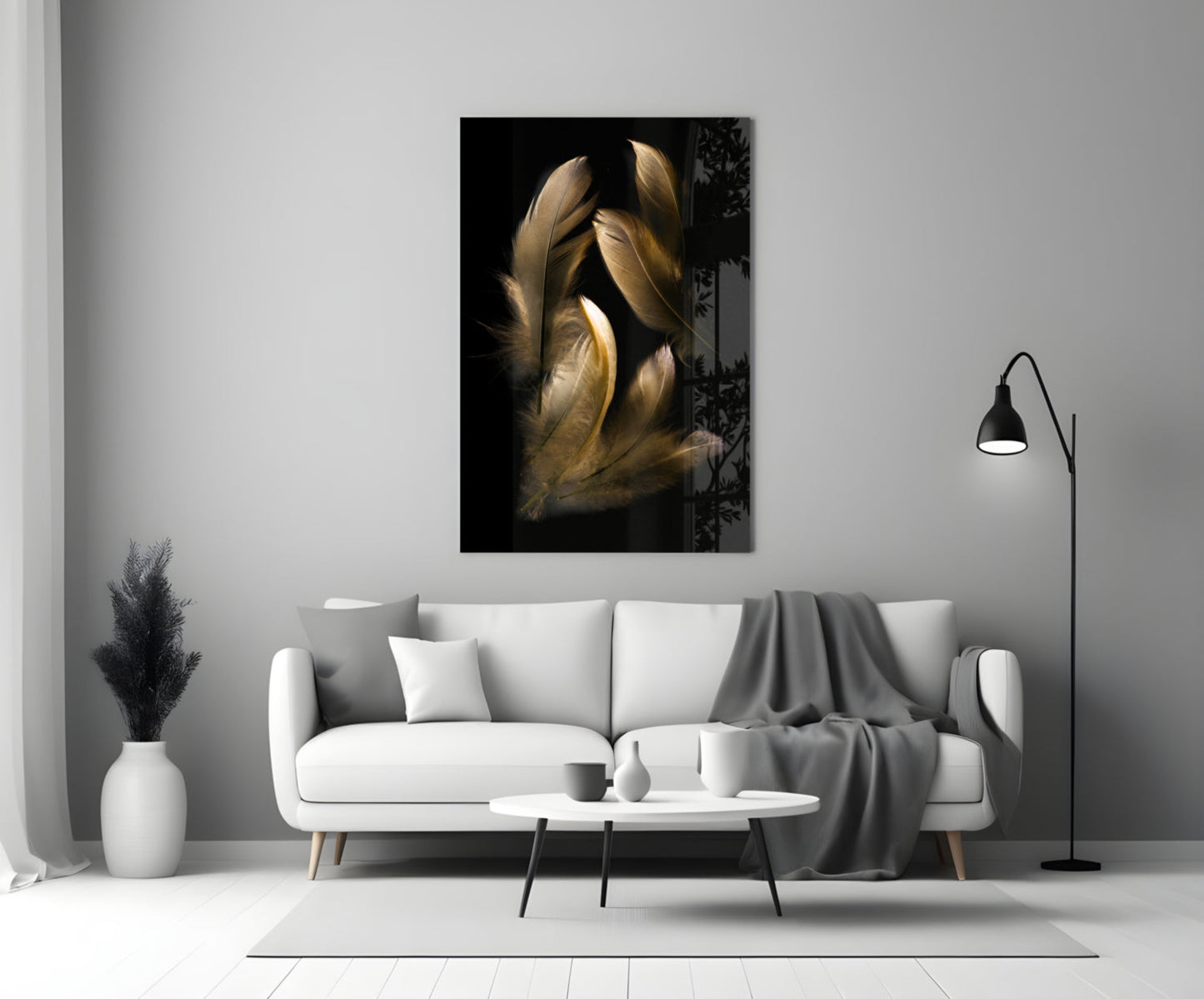 Tan feather glass wall art displayed above a white sofa in a minimalist living room setting.