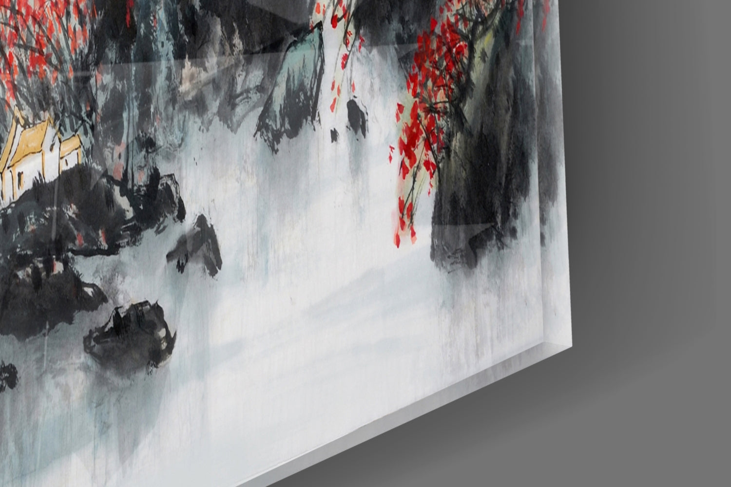 Angled close-up of Japanese glass wall art showing misty landscape with red foliage, black rocks, and gold accents on white surface.