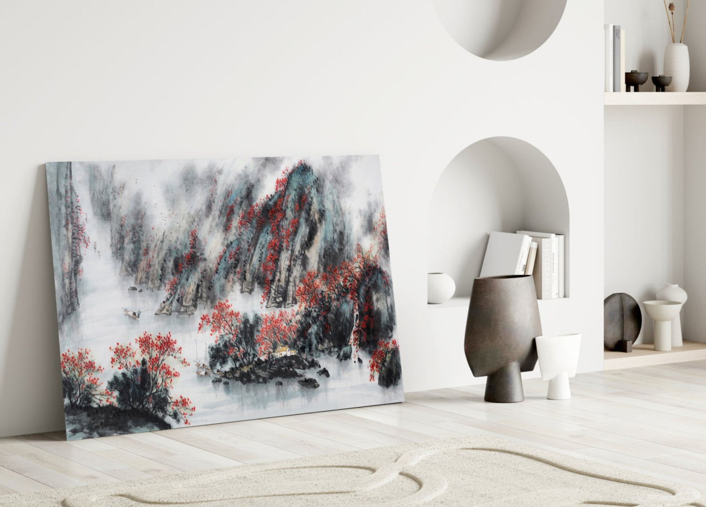 Japanese glass wall art leaning against white wall displays misty mountain landscape with red flowering trees in black, gray, and white tones.
