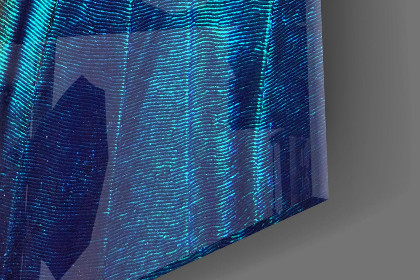 Close-up angled view of iridescent glass wall art displaying shimmering turquoise and blue striped texture with translucent layered effect.