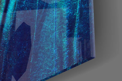 Close-up angled view of iridescent glass wall art displaying shimmering turquoise and blue striped texture with translucent layered effect.