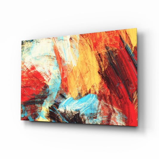 Abstract glass wall art panel displayed at an angle, showing bold red, yellow, and blue brushstrokes with black accents.