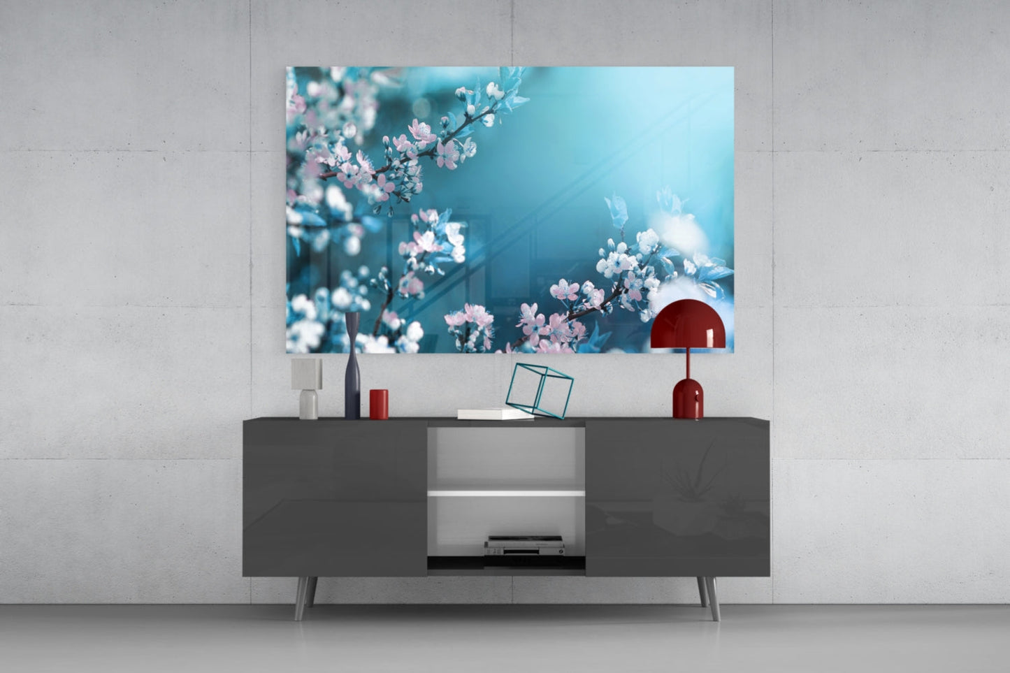 Spring Flowers Glass Wall Art displaying pink and white blossoms on turquoise background, mounted above dark gray media console in modern interior.