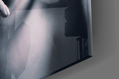 Frosted glass wall art displaying a woman's silhouette in grayscale tones, angled perspective view.