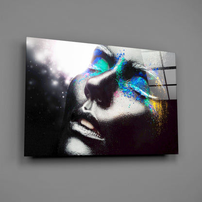 Glass wall art displaying a monochromatic female portrait with vibrant multicolored holographic overlay on the eyes and right side.