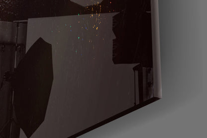 Silhouette of female portrait etched on frosted glass wall art panel with colorful hanging decorative elements above.
