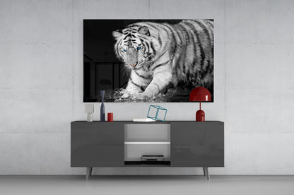 Black and white Bengal tiger glass wall art displayed above gray media console with red decorative accents in modern interior setting.