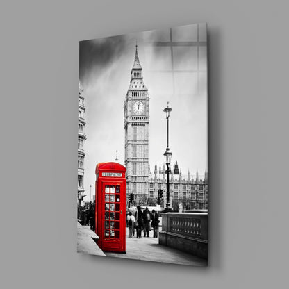 Black and white London street scene with iconic red telephone box, Big Ben, and lamp post displayed on glass wall art panel.