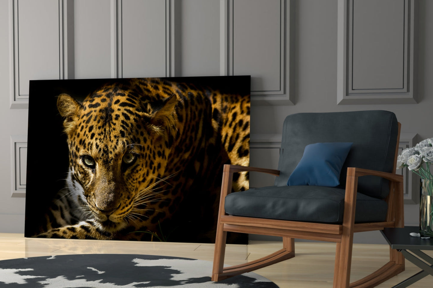 Leopard glass wall art displaying a golden-spotted leopard's face against black background, displayed in modern living room setting.