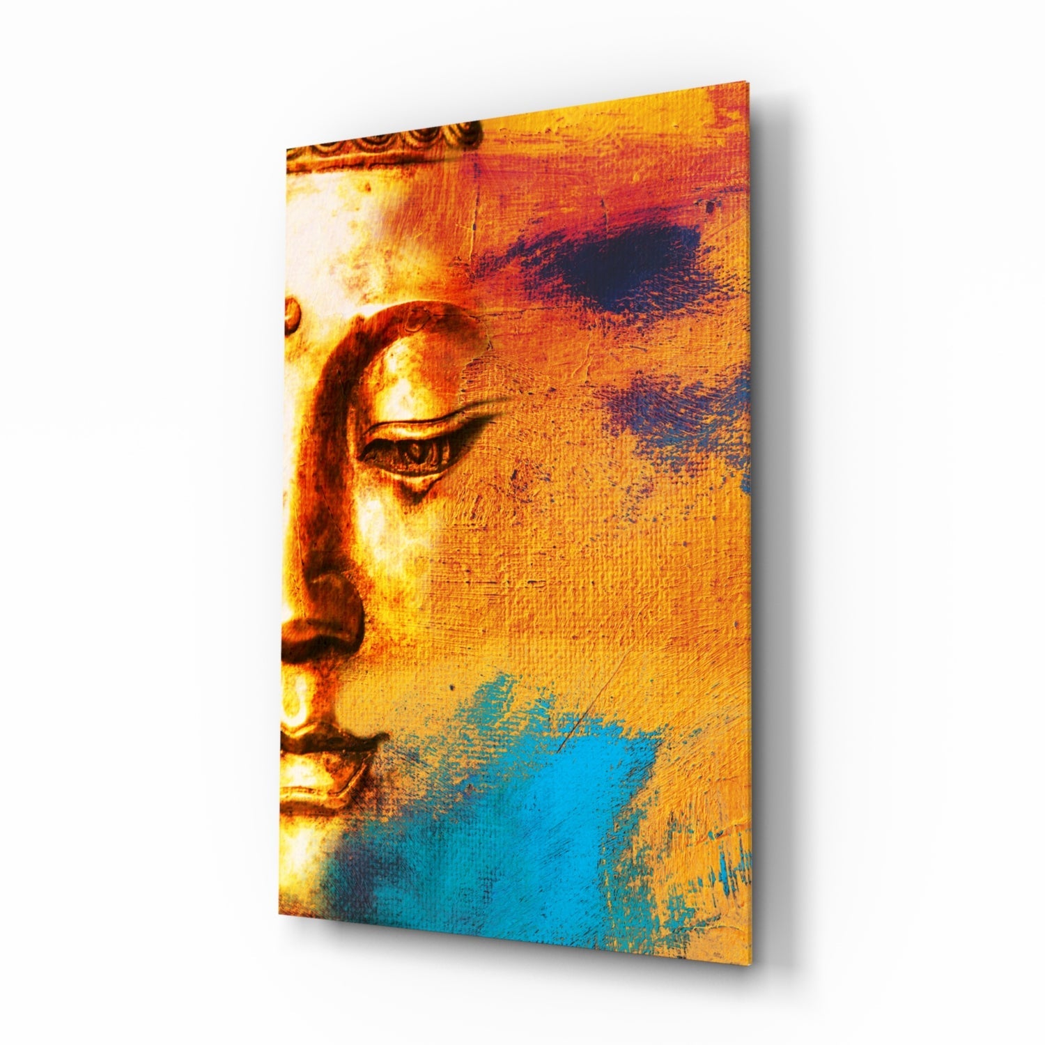 Buddha profile portrait in warm gold and orange tones with blue brushstroke accents on textured glass wall art panel.