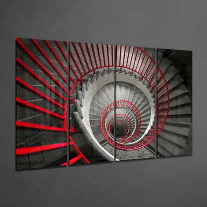 Four-panel glass wall art displaying a spiral staircase shot from above with red railings against grayscale concrete steps.