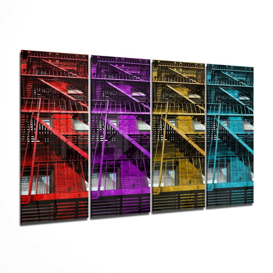 Four glass panels displaying fire escape stairs in red, purple, yellow, and cyan neon-style lighting against dark backgrounds.