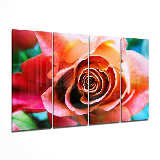 Four-panel glass wall art displaying a close-up vibrant red and orange rose with pink petals and blurred colorful background.