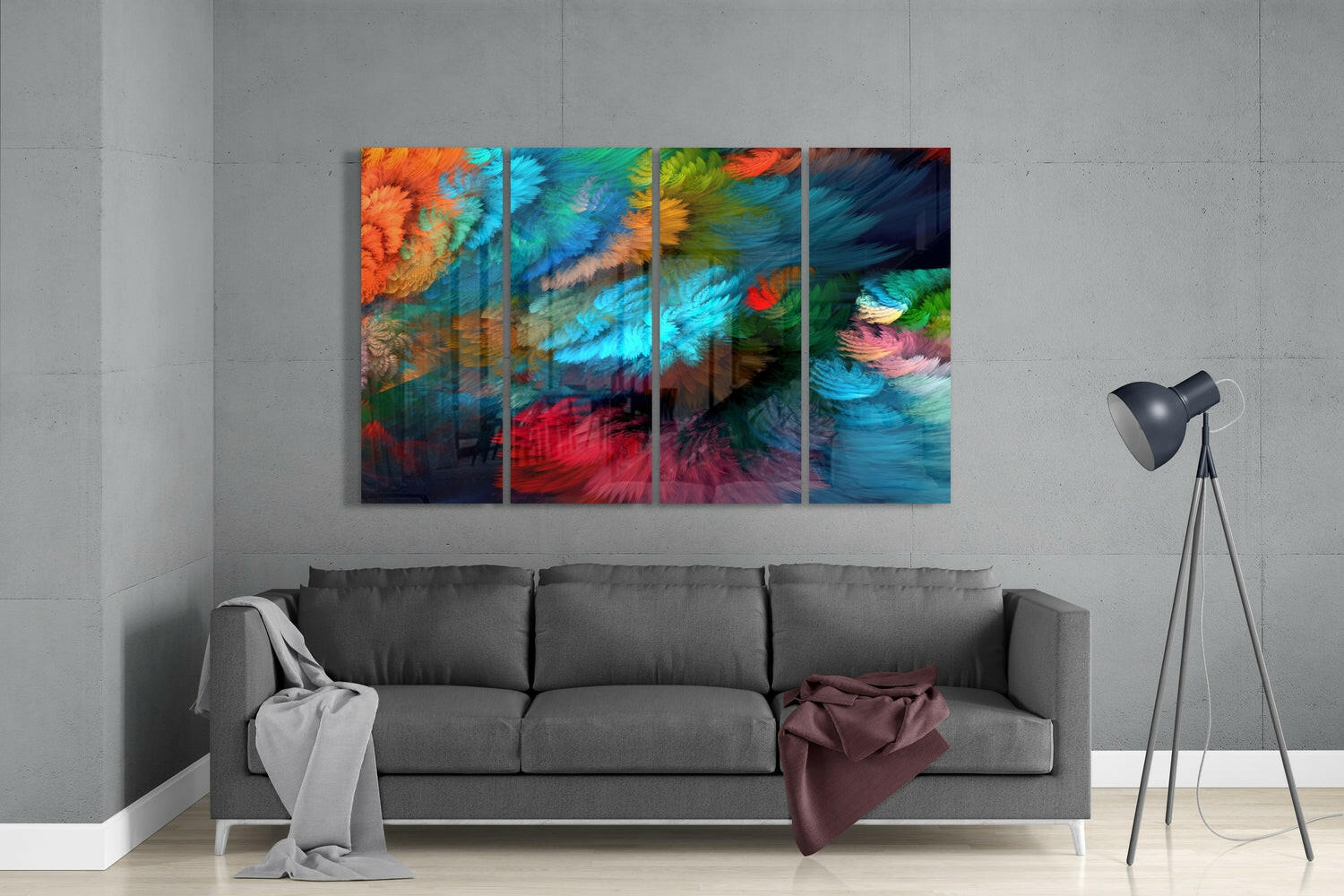 Four-panel colorful abstract glass wall art displayed above gray sofa in minimalist living room setting.