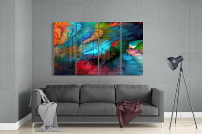 Four-panel colorful abstract glass wall art displayed above gray sofa in minimalist living room setting.
