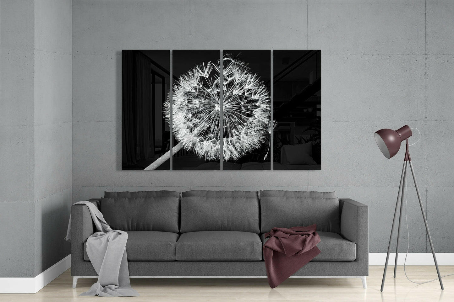 Modern living room interior with gray sofa displaying four-panel black and white dandelion artwork above it.