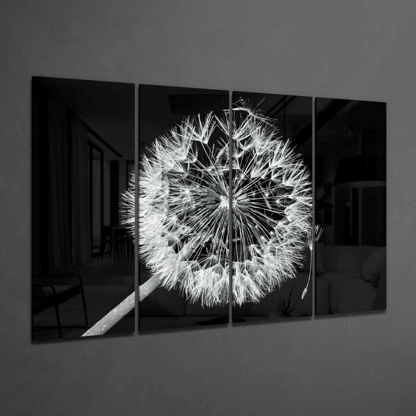Four black glass panels mounted on gray wall displaying a detailed black and white photograph of a dandelion seedhead.