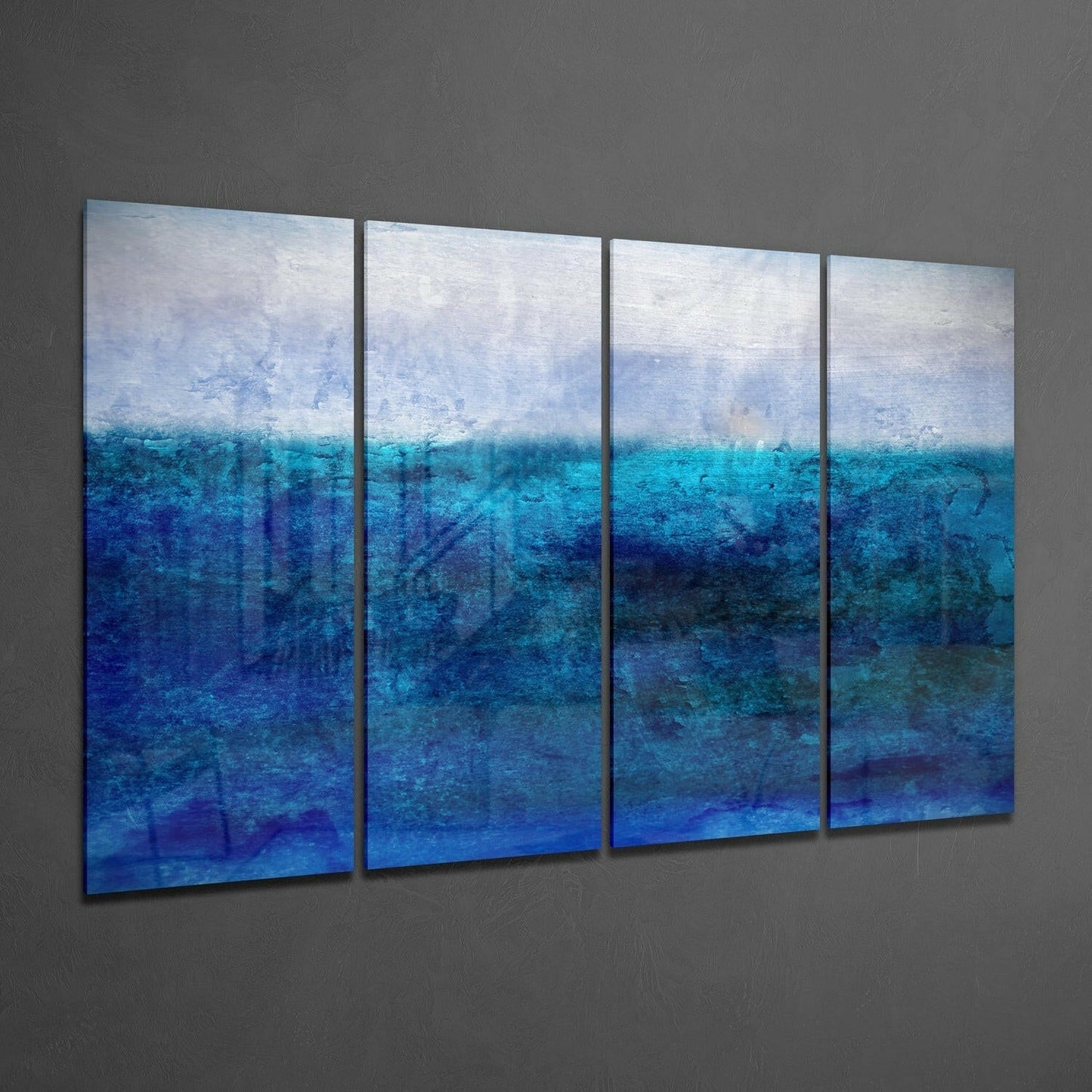 Four-panel glass wall art displaying a layered seascape with white sky transitioning through turquoise to deep blue water, mounted on gray wall.