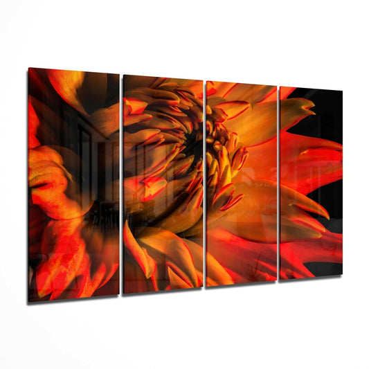 Four-panel glass wall art displaying a close-up macro view of a vibrant red and orange gerbera daisy with dramatic lighting and dark backgrounds.