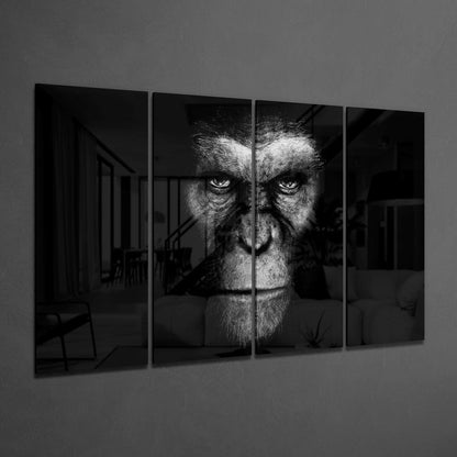 Four-panel black and white glass wall art displaying a close-up primate face with intense eyes against a dark interior background.