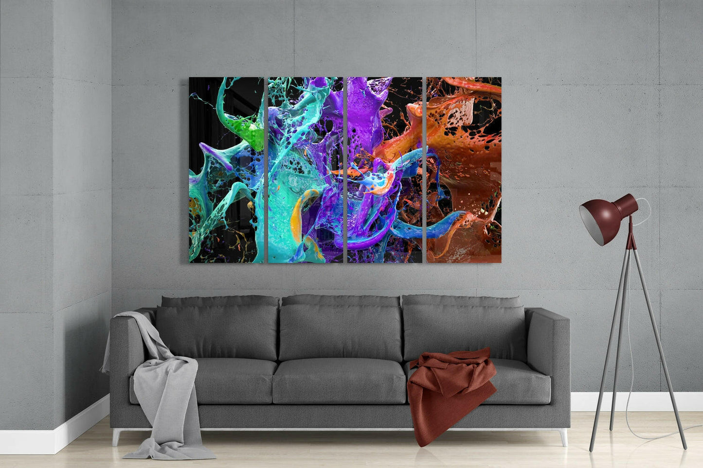 Colorful abstract glass wall art featuring vibrant swirls of cyan, purple, orange, and yellow displayed above gray sofa in modern living room.