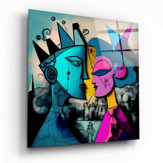 Angled view of glass wall art displaying two cubist profile faces in cyan and magenta with crowns, castle, and geometric shapes against light background.