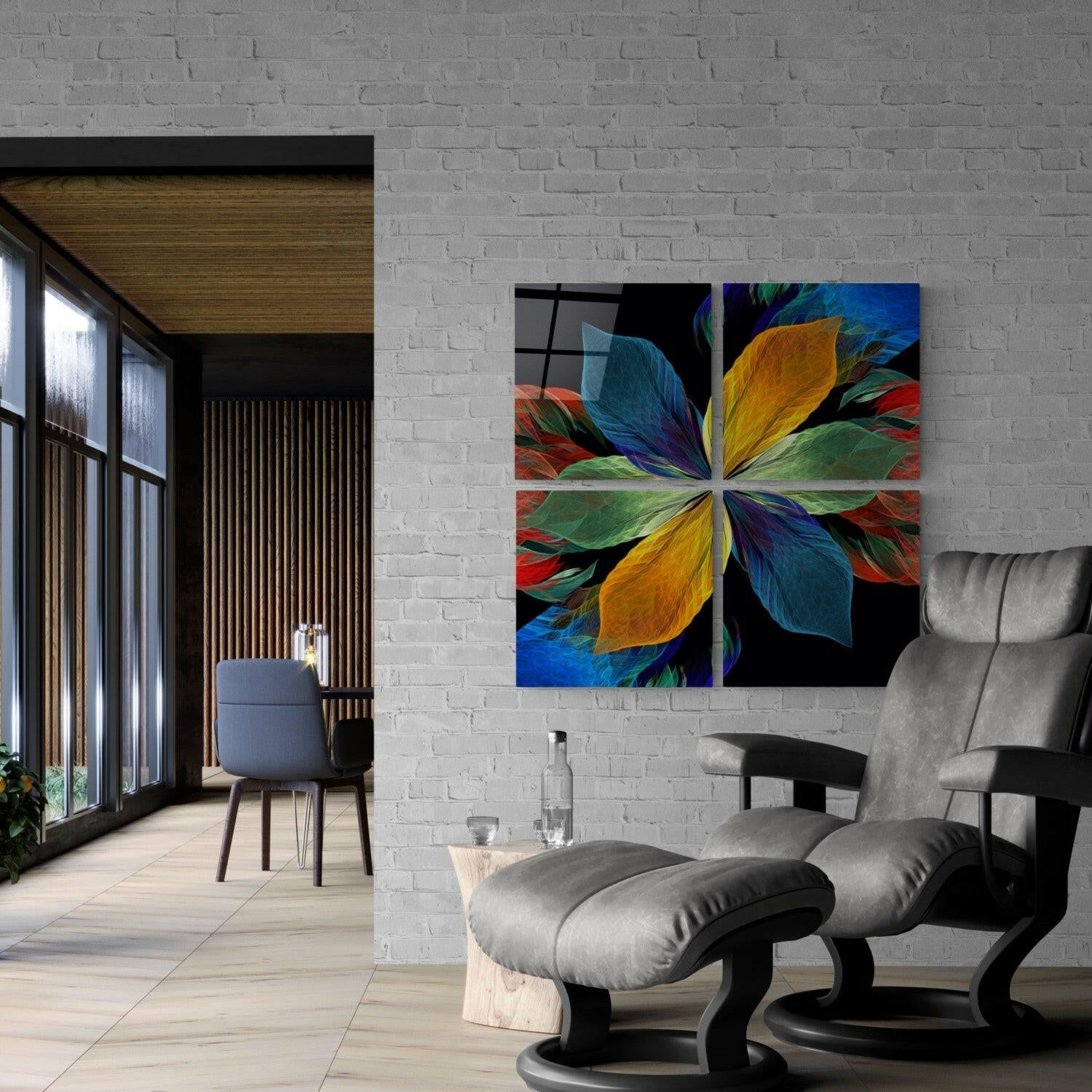 Colorful four-panel glass wall art displaying symmetrical flower petals in blue, yellow, green, and red mounted on white brick in modern living room.