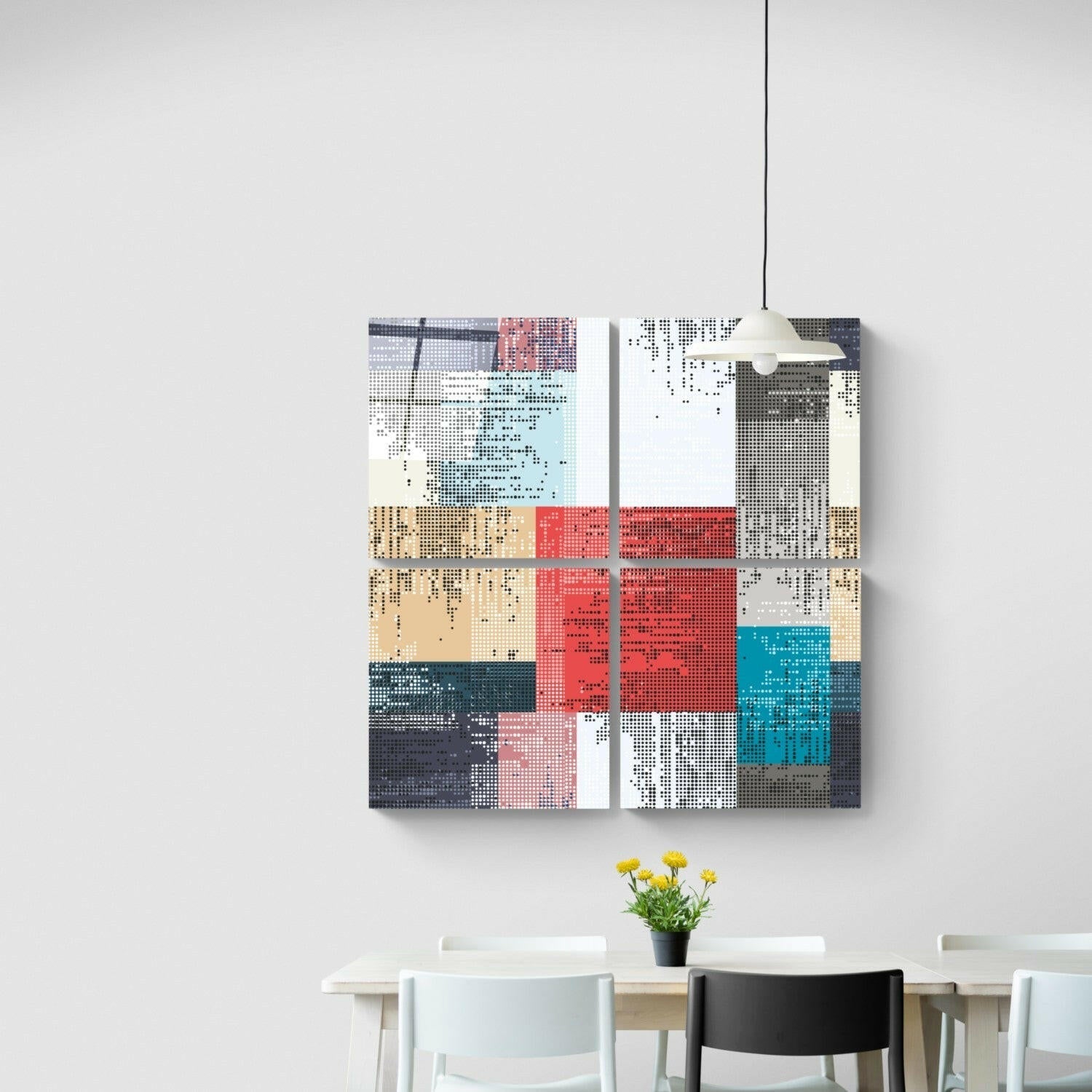 Two colorful pixelated glass panels hung above a dining table with chairs and yellow flowers.
