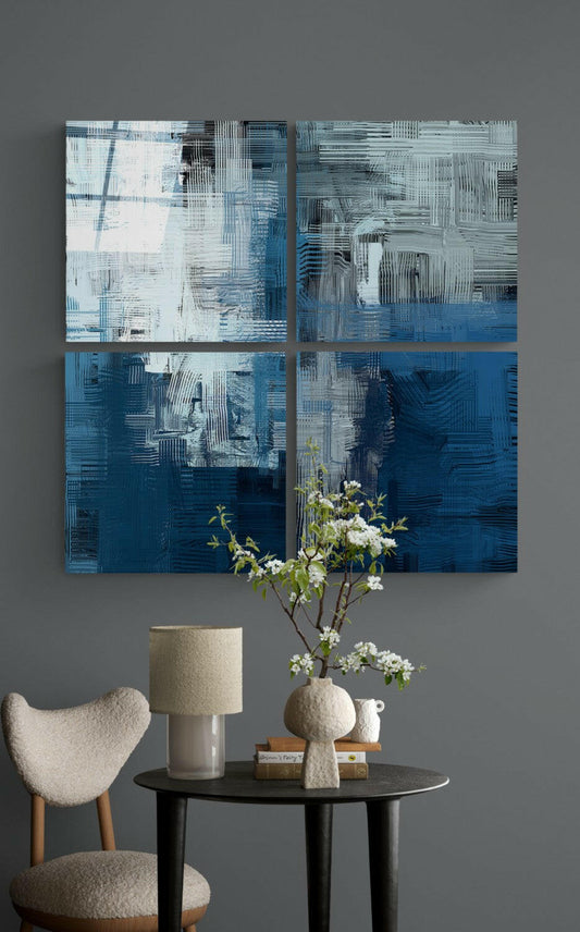 Blue Touch Quadro Glass Wall Art displayed above a black round table with cream chair, lamp, vase with white flowers, and decorative objects.