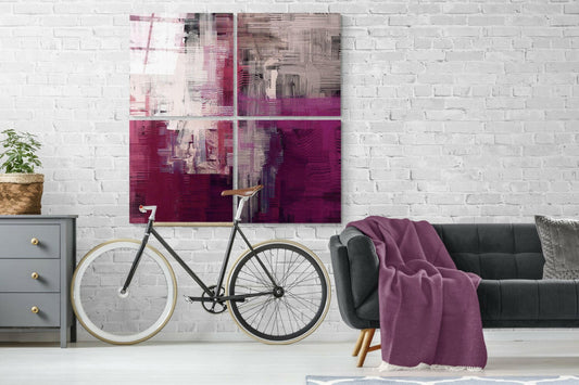 Purple Touch Quadro Glass Wall Art displayed as four panels above a bicycle and sofa in a modern living room with white brick walls.