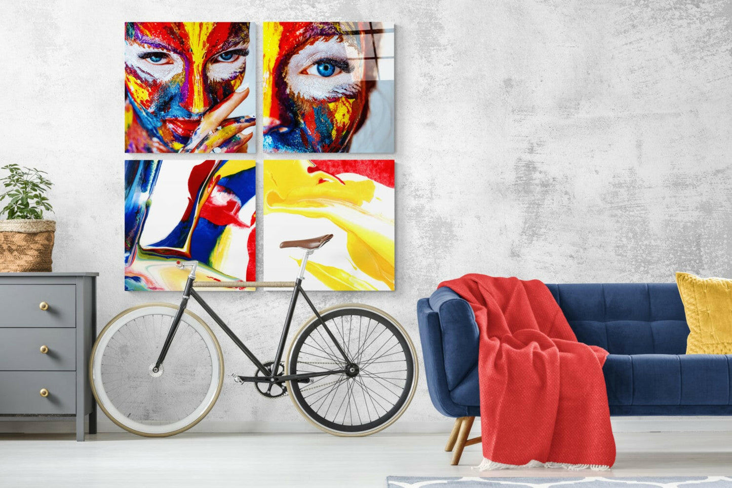 Colorful abstract woman's face artwork displayed as four glass panels above a bicycle in modern living room interior.