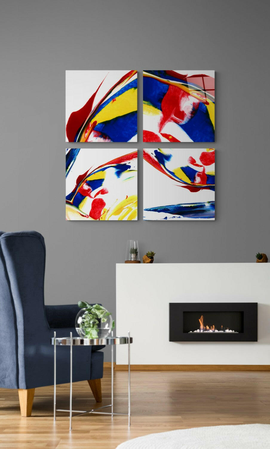 Four-panel glass wall art with abstract red, blue, and yellow brushstrokes displayed above a fireplace in a modern living room.