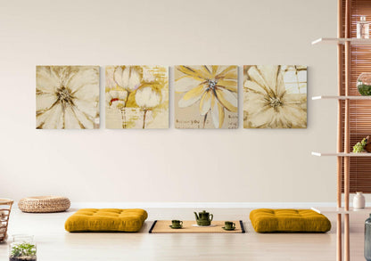 Four cream and yellow flower canvas artworks hanging horizontally above a white bench with gold cushions and tea service.