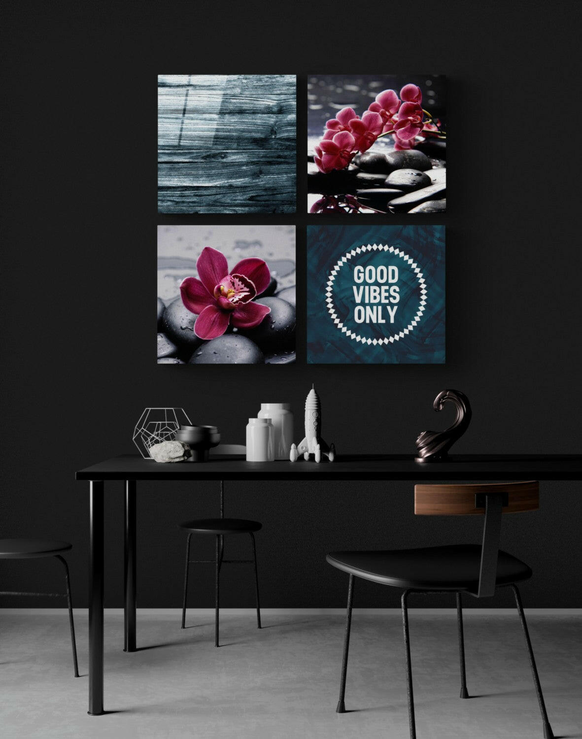 Four glass wall panels above a black desk displaying orchids, stones, wooden texture, and "Good Vibes Only" text in a modern interior setting.