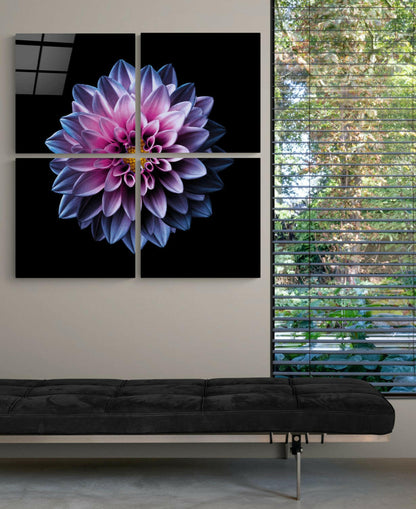Four-panel glass wall art displaying a purple and pink chrysanthemum flower against black background, mounted above black bench beside windows.