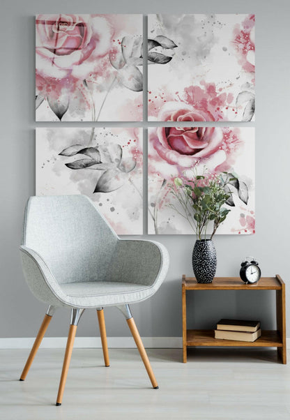 Four-panel glass wall art displaying watercolor roses in pink and gray tones above a light gray chair and wooden side table with flowers and clock.