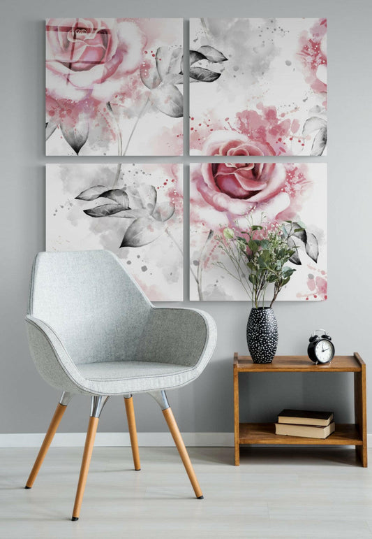 Four-panel glass wall art displaying watercolor roses in pink and gray tones above a light gray chair and wooden side table with flowers and clock.