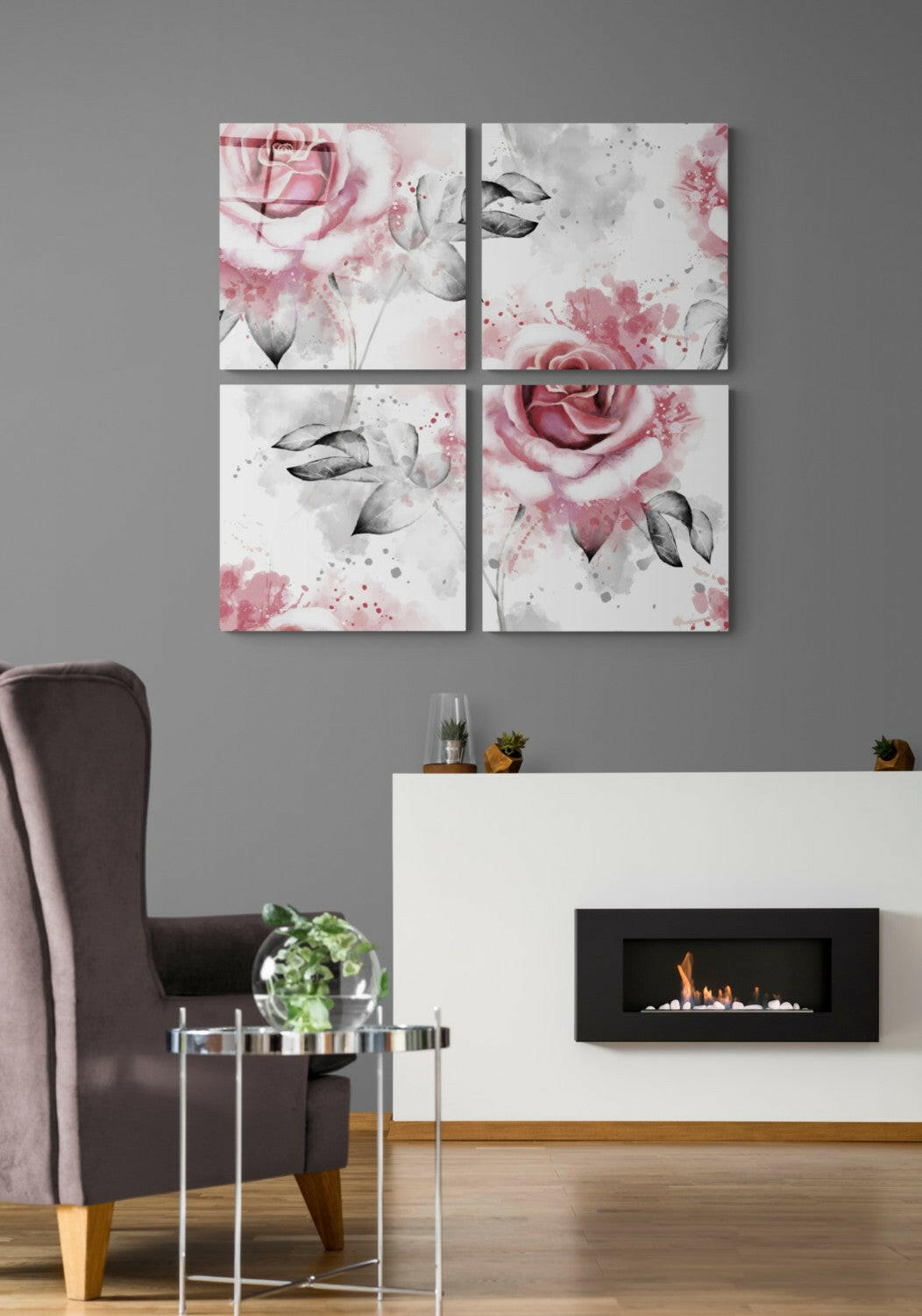 Four-panel glass wall art displaying pink watercolor roses with black leaves and gray splashes on white background, installed above fireplace.