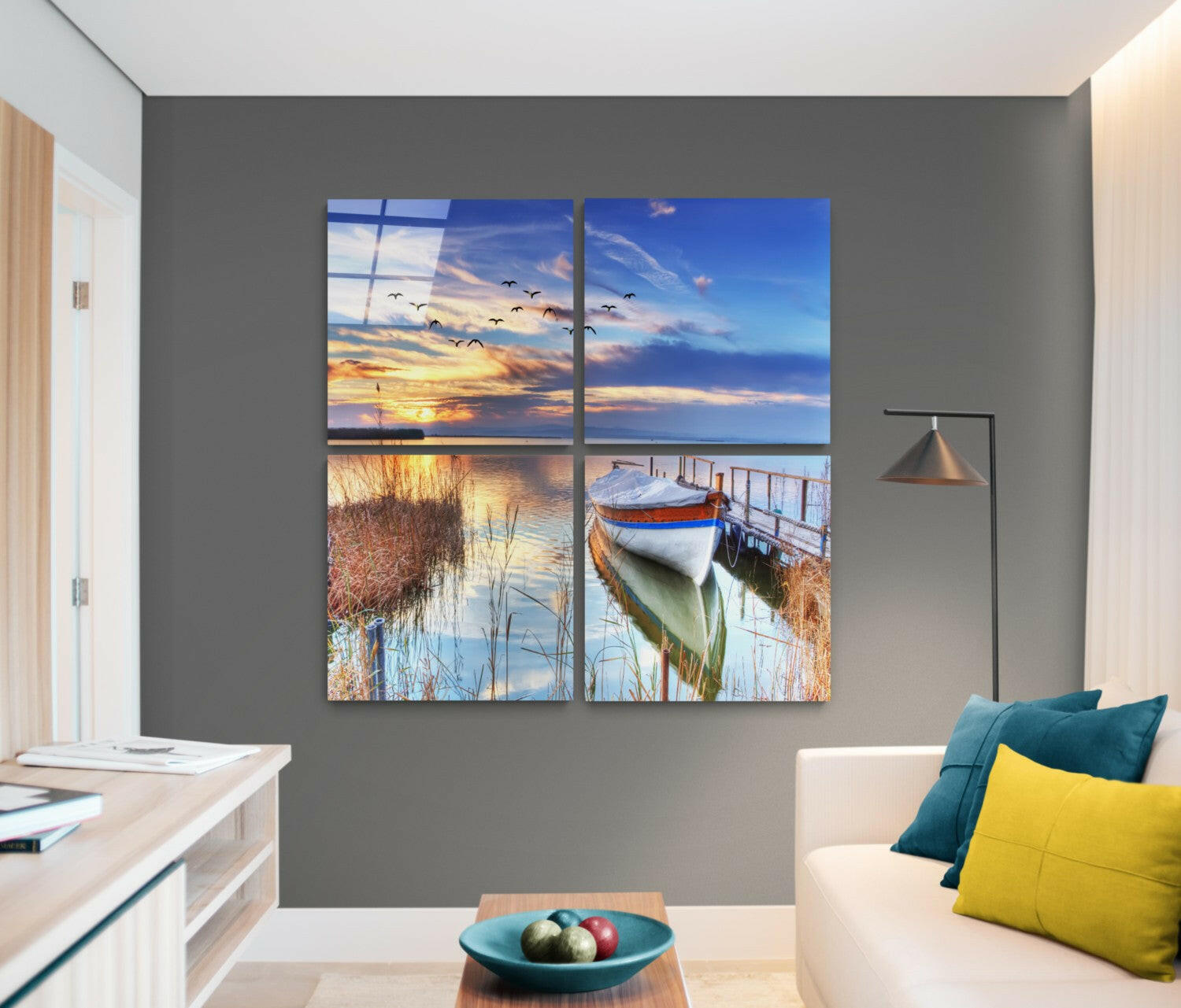 Four-panel glass wall art displaying sunset sky, flying birds, marsh reeds, and moored boat in warm and cool tones.