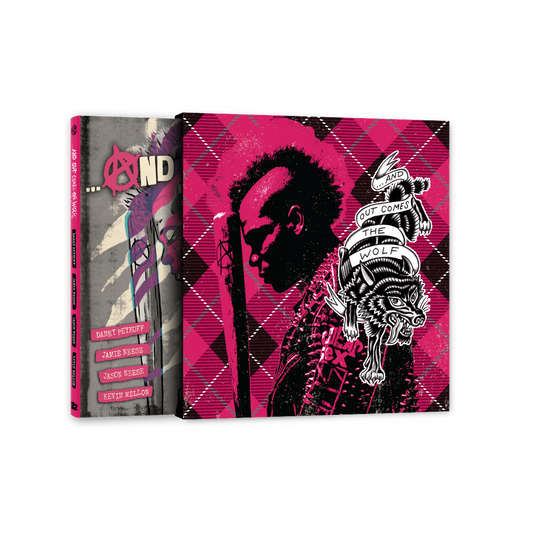 Open deluxe edition graphic novel displaying left cover with anarchy symbol and author names, and right cover featuring silhouetted profile portrait, argyle pattern, and decorative wolf illustration in magenta, black, and white.