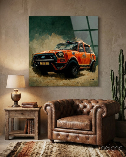 Orange rally truck with dust cloud displayed on canvas wall art above leather armchair in rustic interior setting.