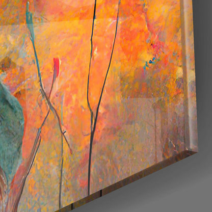 Close-up angled view of colorful glass wall art with warm orange, yellow, and red tones, featuring thin dark lines and green accents.