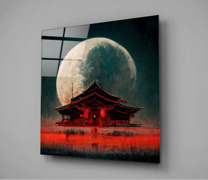 Glass wall art panel displaying a red Asian pagoda beneath a large moon against a dark teal starry sky.