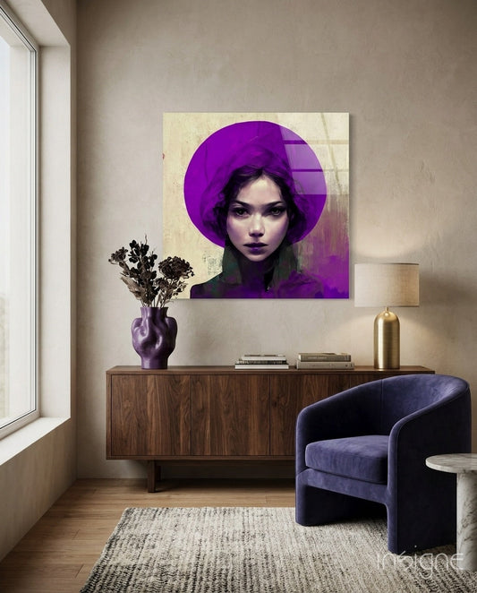 Modern interior scene featuring purple-toned portrait glass wall art above wooden dresser with purple vase and brass lamp.