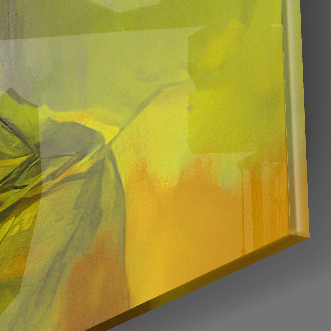 Close-up angled view of yellow glass wall art showing brushstroke details and warm color gradient from yellow to orange.