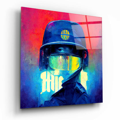 Angled view of glass wall art featuring a figure in protective gear with glowing neon yellow and blue accents against vibrant red and blue gradient background.