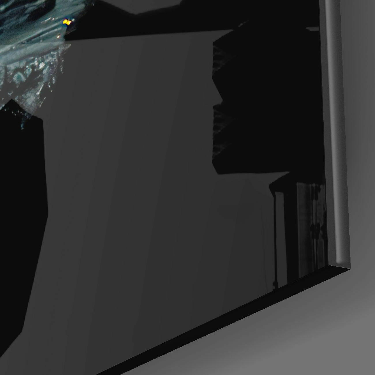 Close-up angled view of Lost City Glass Wall Art showing dark silhouetted architectural forms and textured blue-toned glass detail against white wall.